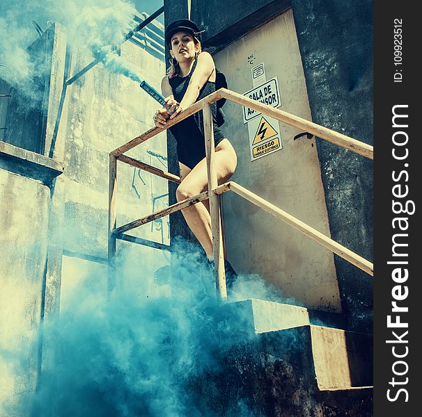 Woman In Black One Piece Swimsuit On Stairs