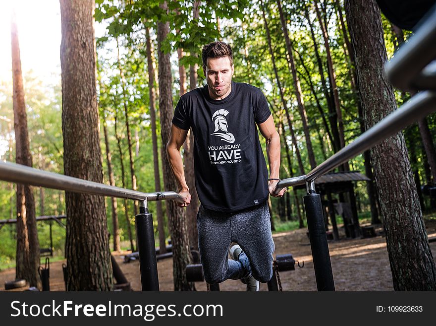Man In Black T-shirt Doing Exercise