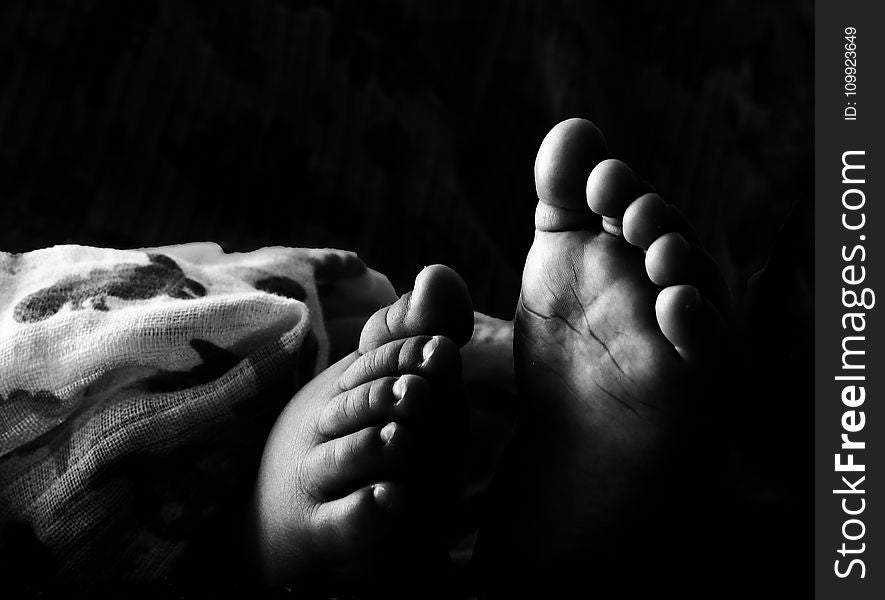 Grascale Photography of Toddlers Foot