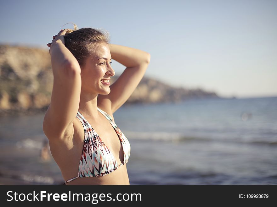 Blonde Haired Woman Wearing White 2-piece Swimsuit