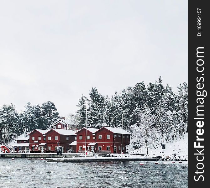 Red Concrete Houses Surrounded With Snow