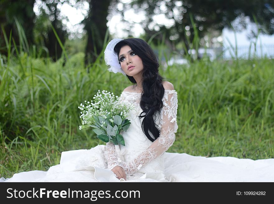 Woman Wearing of White Off-shoulder Bridal Dress