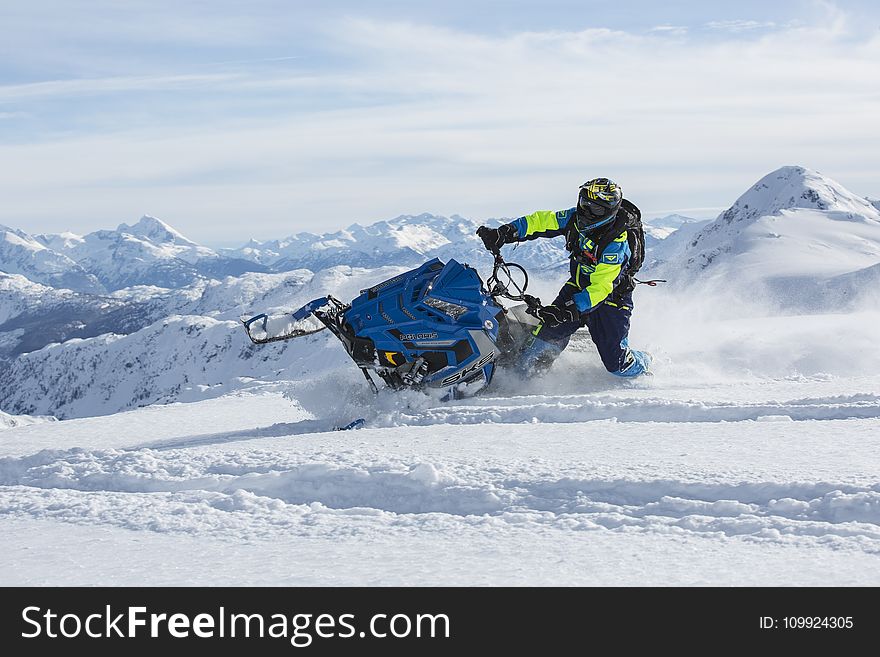 Man Riding Blue Snow Ski Scooter