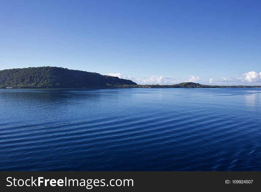 Landscape Photography Of Body Of Water Near Mountain