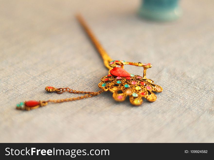Focus Photography of Yellow and Multi-colored Hair Stick