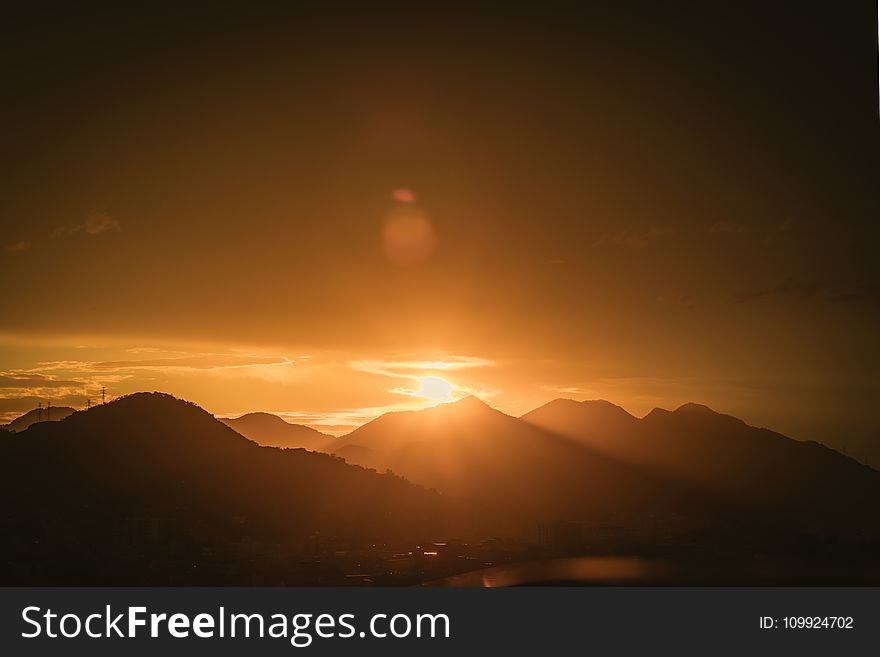 Silhouette Photo of Mountain Range during Golden Hour