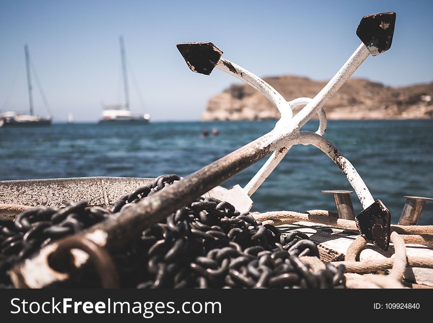 White and Black Anchor With Chain at Daytime