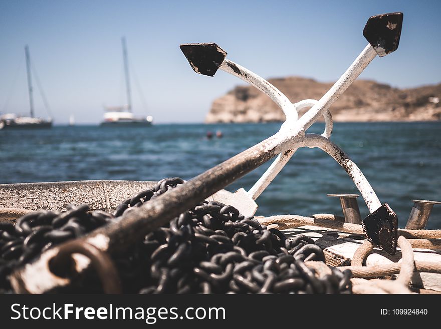 White And Black Anchor With Chain At Daytime