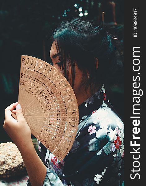 Japanese Woman Holding Brown Hand Fan