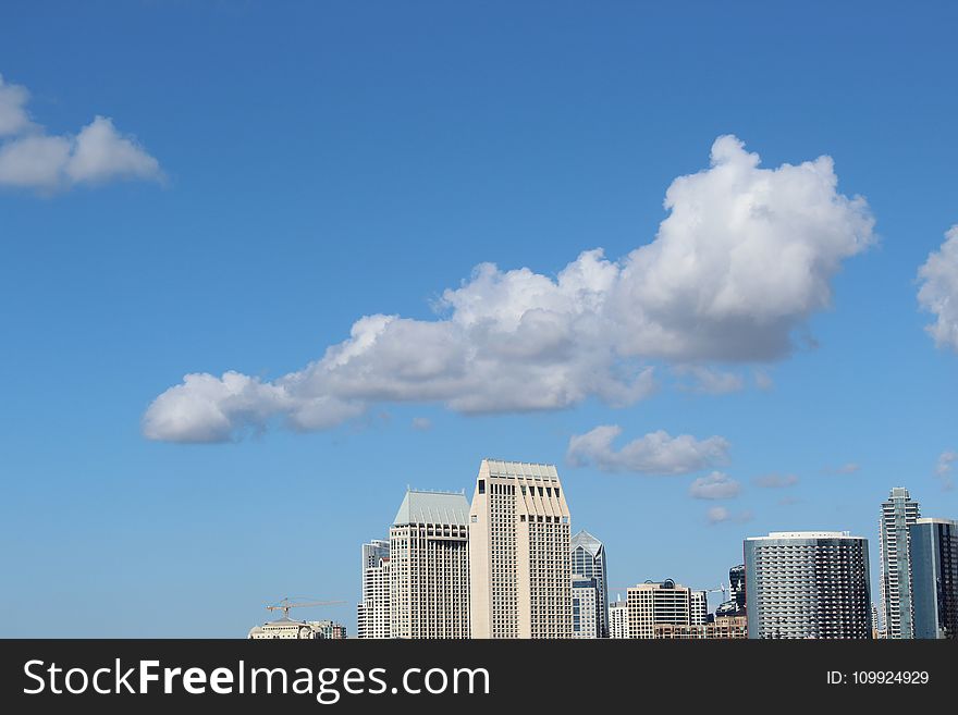 Cumulus Clouds Above High-rise Building