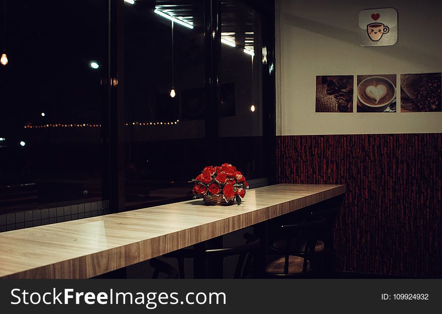 Red Rose Arrangement Decor on Brown Wooden Desk