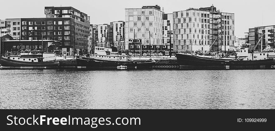 Grayscale Photography Of Buildings And River