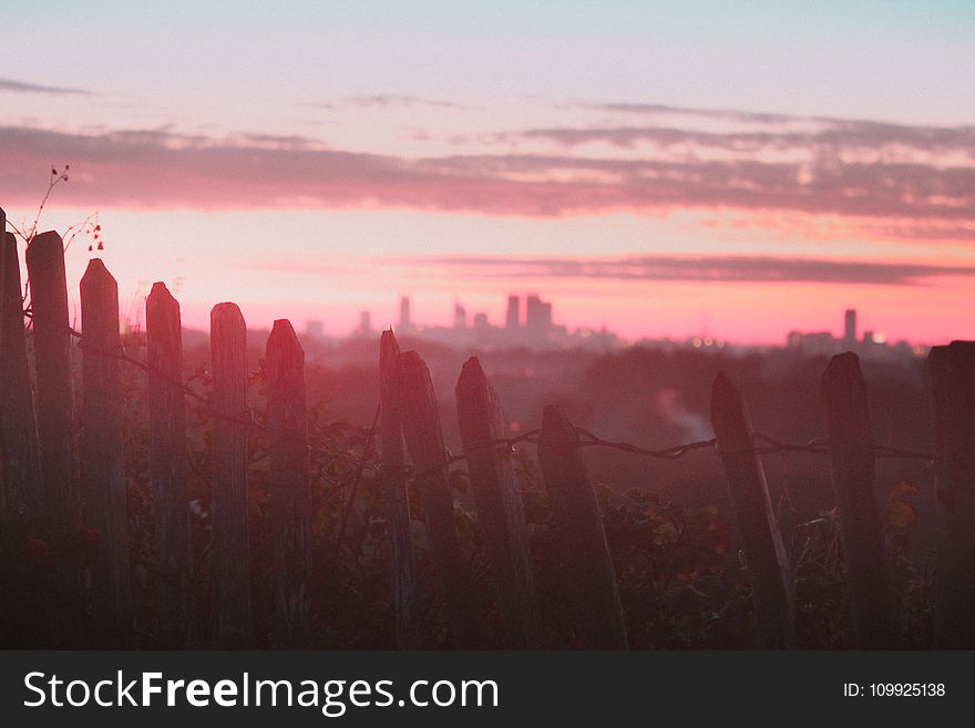Photography of White Wooden Fence during Sunset