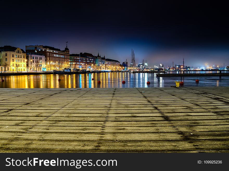 Panoramic Photo Of City Buildings During Night Time