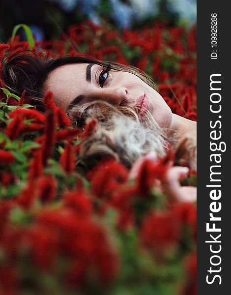 Photography Of A Woman Lying On Flowers