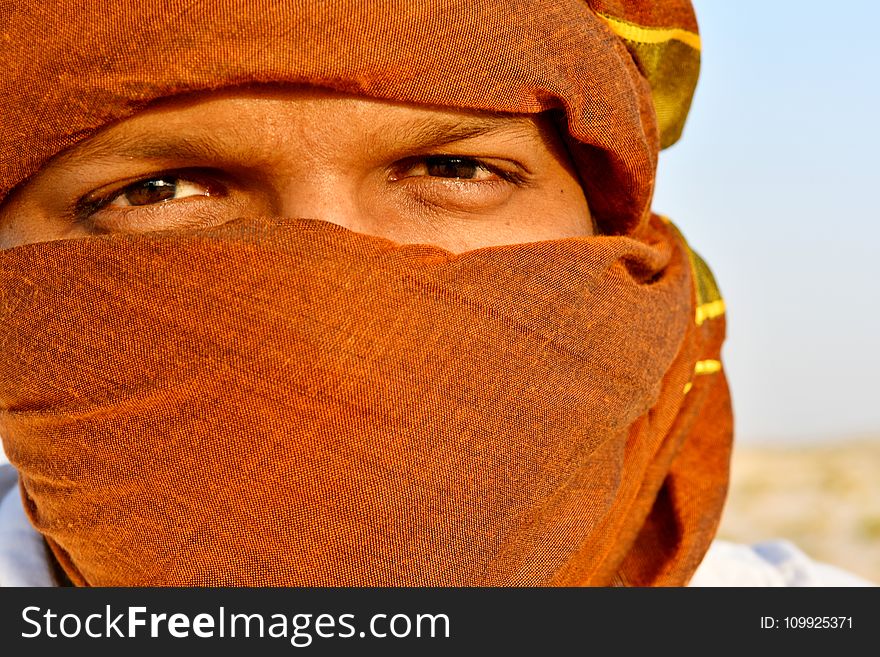 Man Cover Face Using Scarf