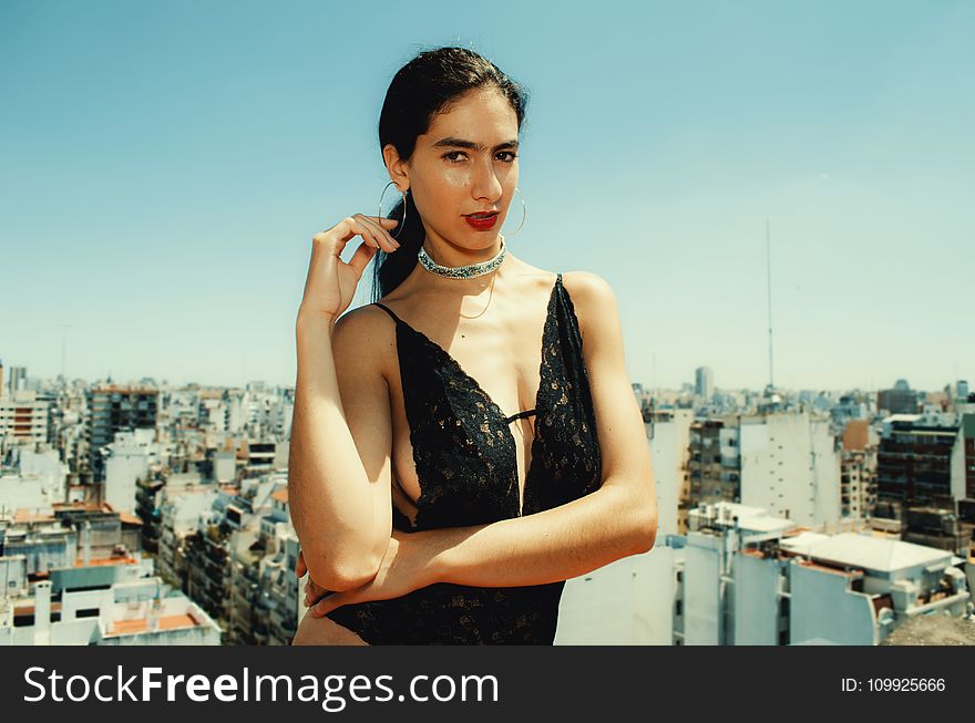 Woman Wearing Black Monokini Behind Highrise Building