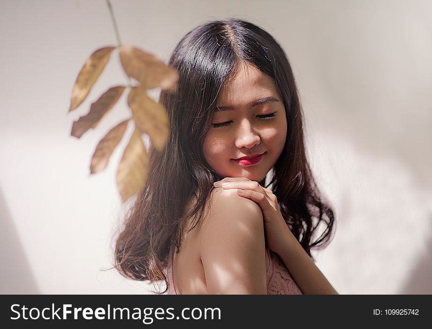 Woman Wearing Brown Sleeveless Top