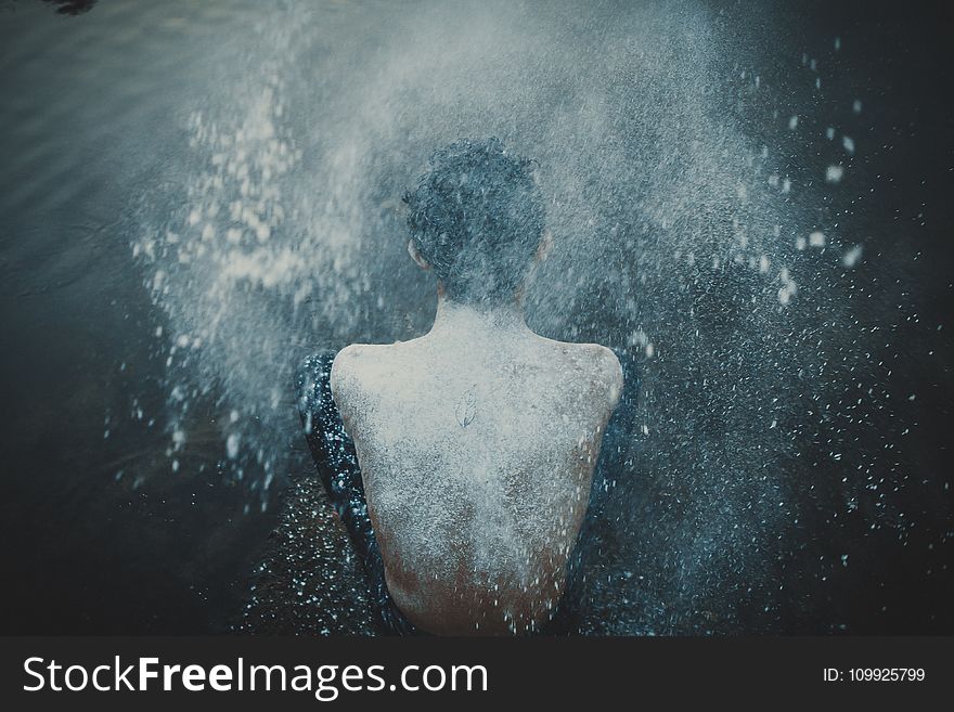 Person Splashing Powder on His Back
