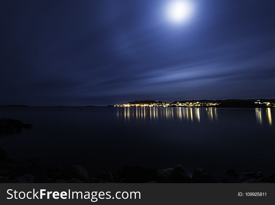 Silhouette Of Mountain Beside Seashore