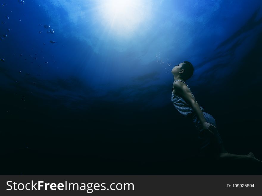 Painting of a Person Swimming Underwater