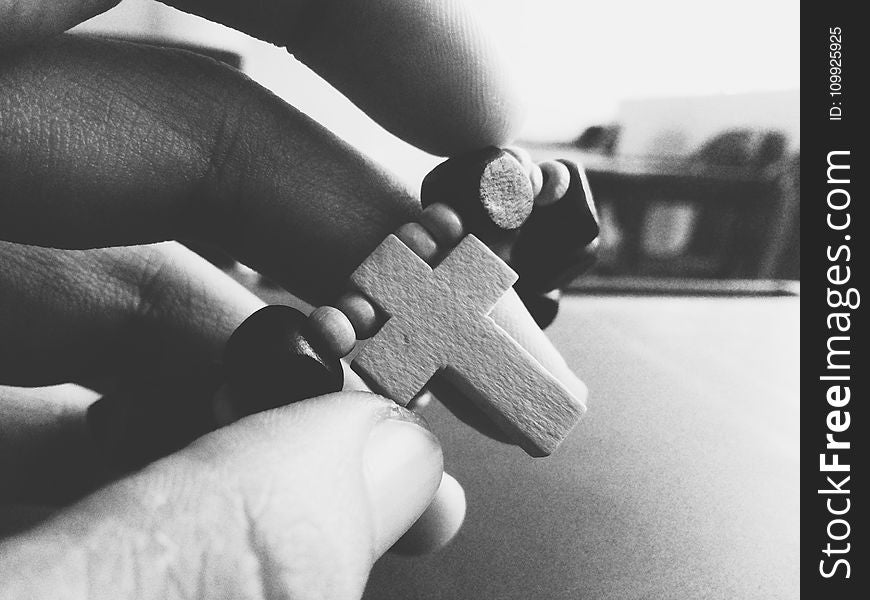 Grayscale Photography Of Person Holding Rosary