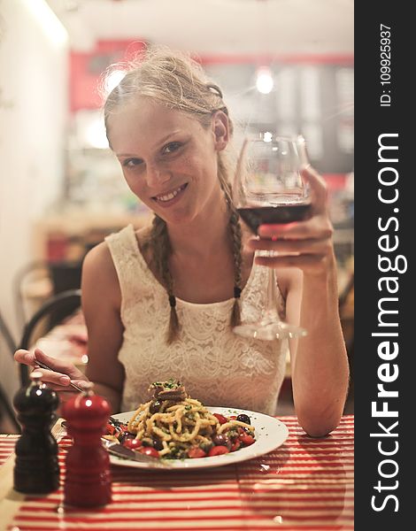 Woman In White Sleeveless Tops Holding Wine Glass