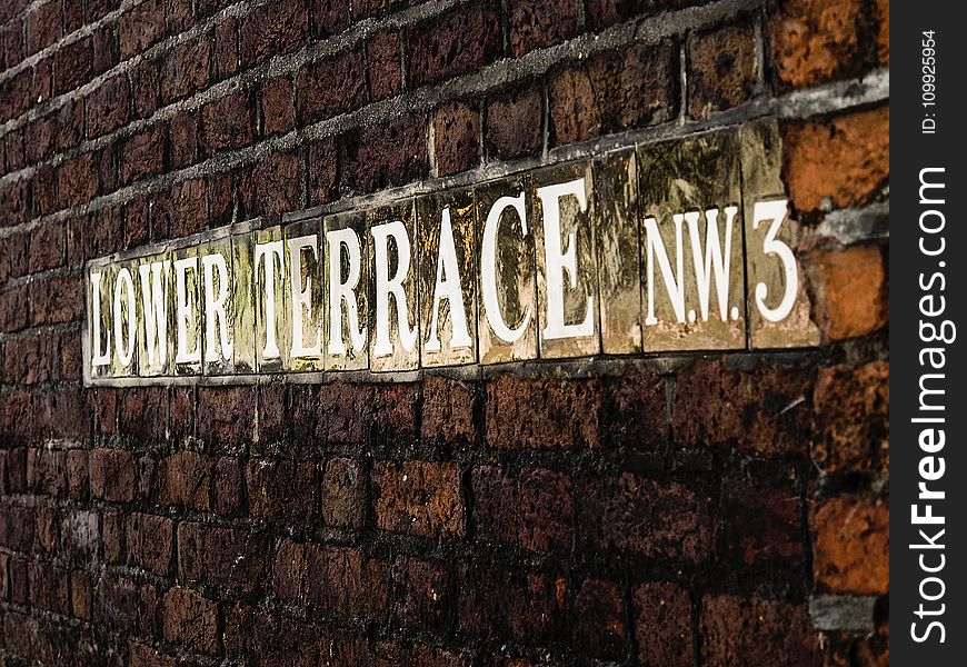 Lower Terrace Signage On Brick Wall