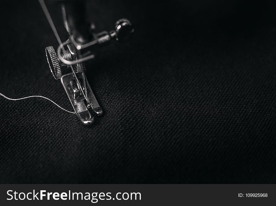 Closeup Photography Of Presser Foot Of Sewing Machine