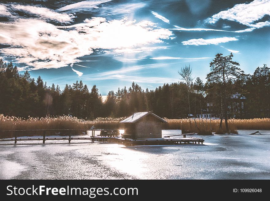 Brown Shack in the Middle of Frozen Lake