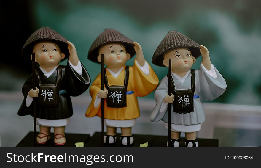 Three Children in Brown Traditional Hats Toy Miniatures