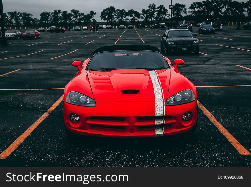 Red Convertible Coupe on Black Surface