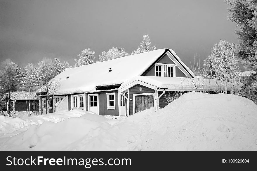 Monochrome Photography Of Snow Capped House