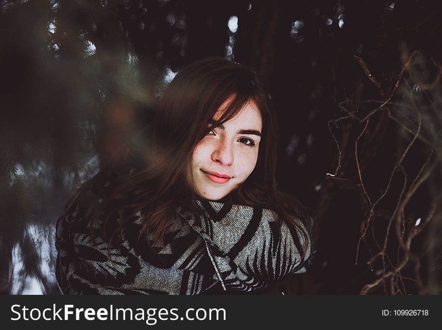 Woman in Black and Gray Sweater Posing Smile for Photo