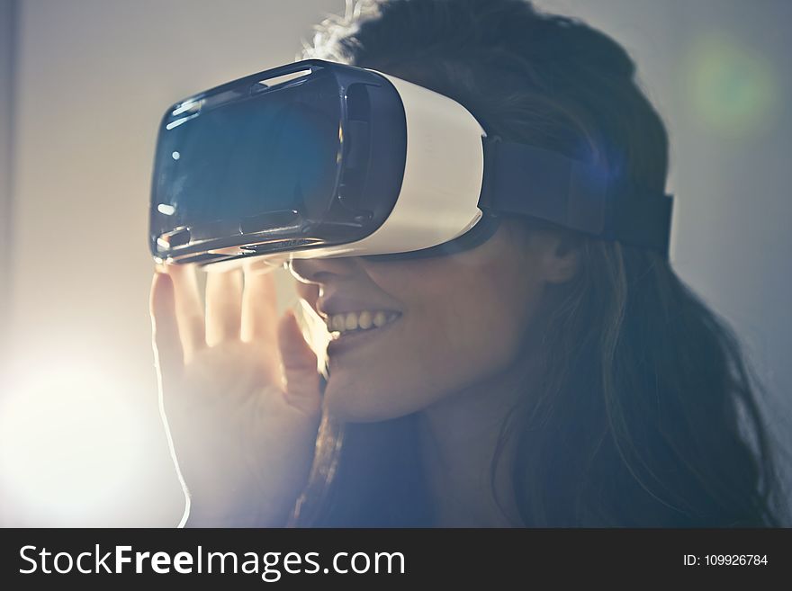 Man Wearing White Virtual Reality Goggles