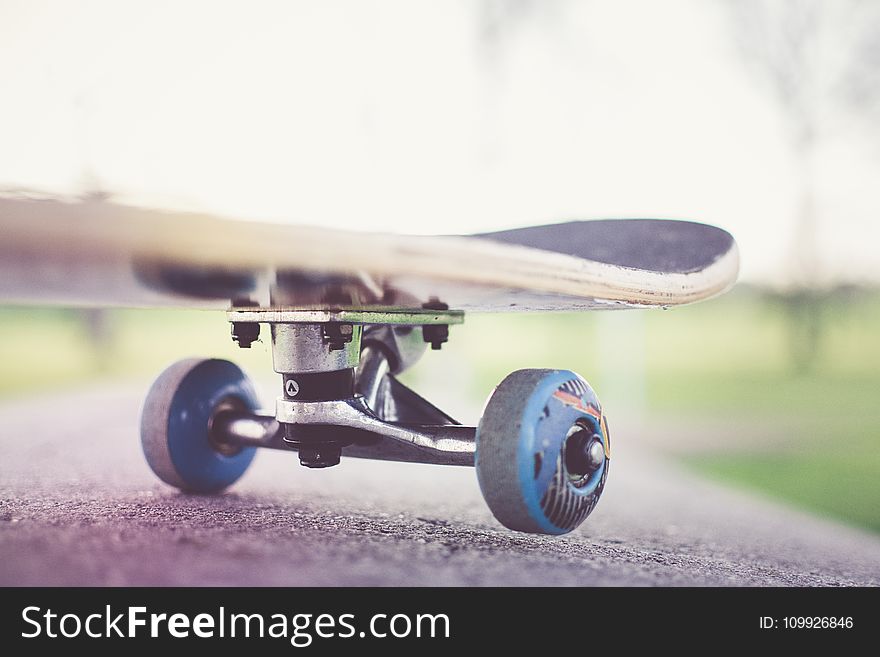 Tilt Shift Lens Photography of Black Skateboard