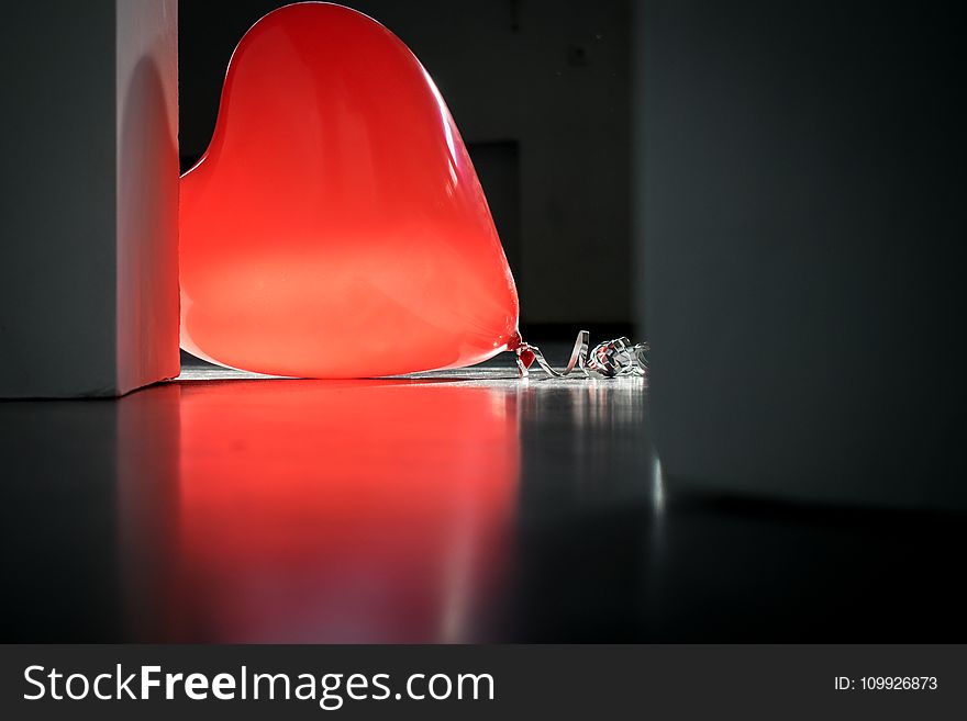 Red Heart Balloon on Top of Floor