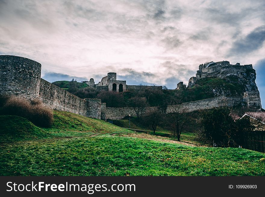 Gray Castle Under Cloudy Sky