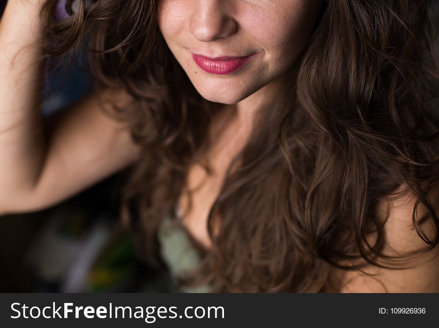 Selective Focus Photography of a Smiling Woman