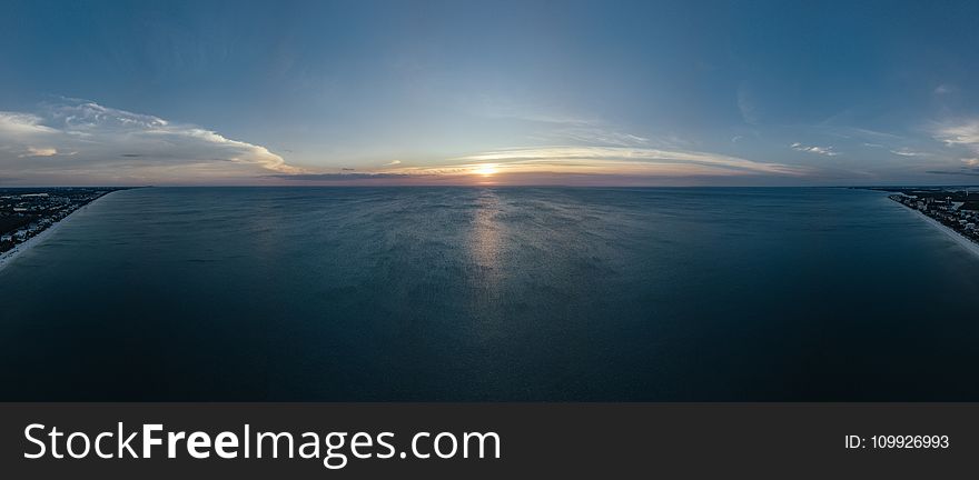 Scenic View of Ocean During Sunset