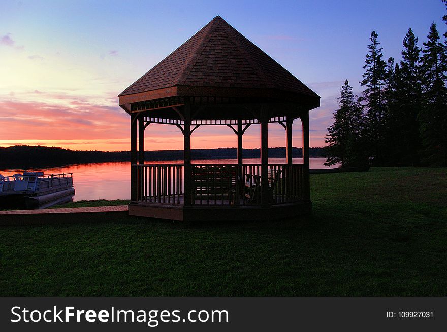 Brown Canopy Tent Near On Body Of Water