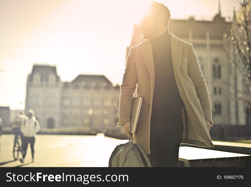 Photo of Man Wearing Brown Coat