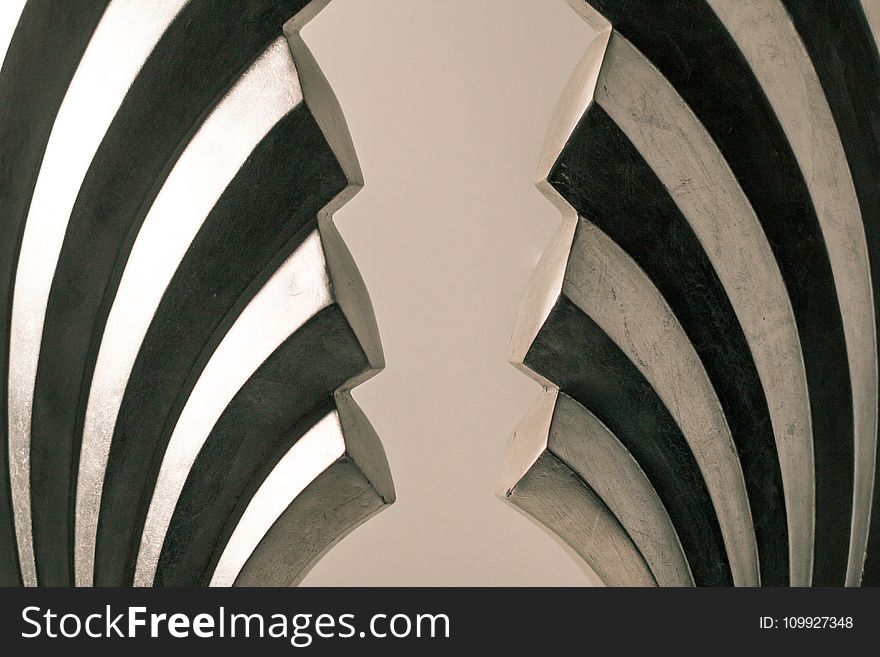 Gray and Black Steel Wall Decoration on White Surface