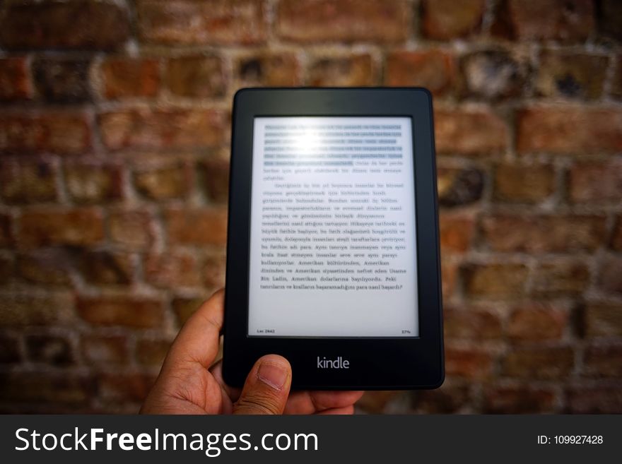 Person Holding Amazon Kindle Ebook