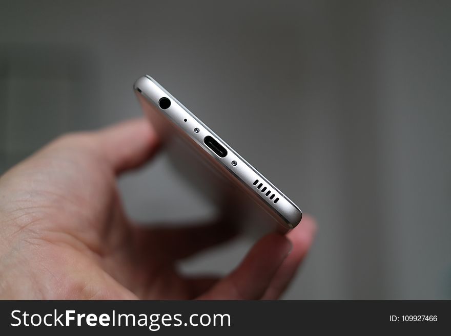 Person Holding Silver Iphone 7