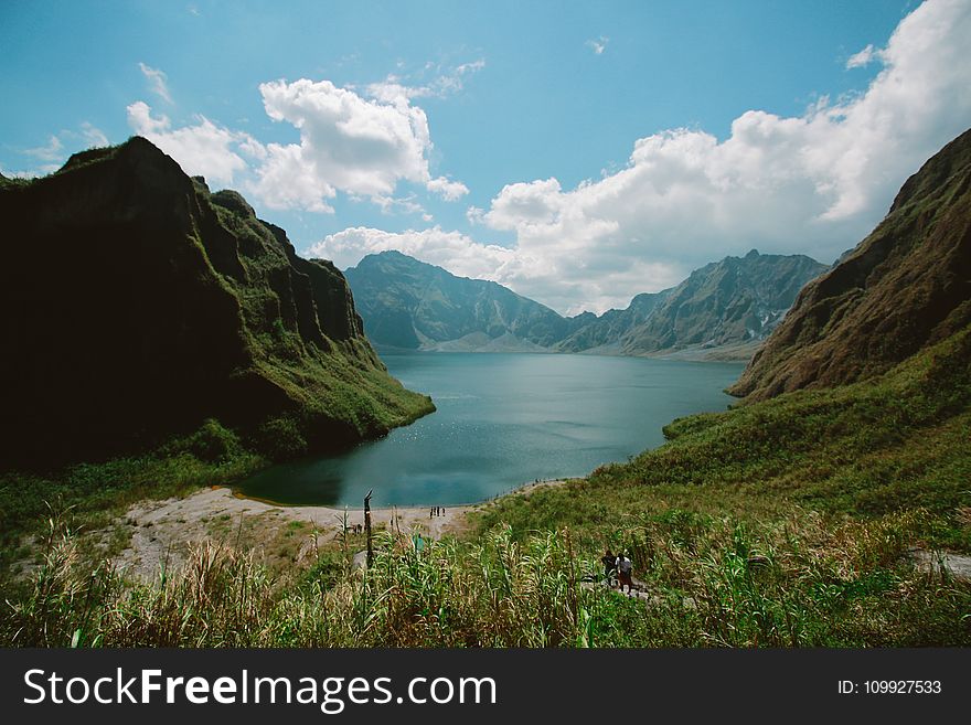 Photography of Mountains Near Body of Water