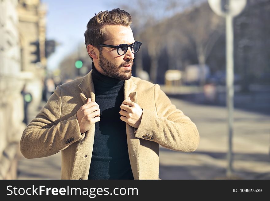 Man Wearing Eyeglasses and Brown Jacket