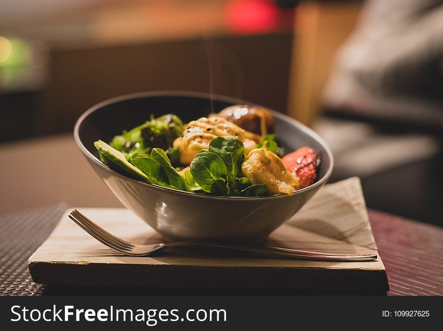 Round Stainless Steel Bowl With Cooked Meat And Vegetables