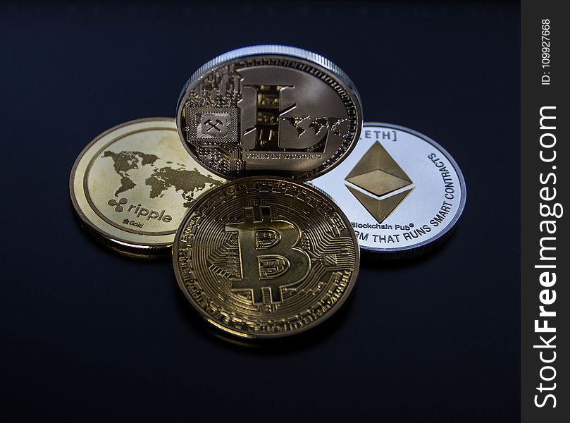 Four Assorted Cryptocurrency Coins