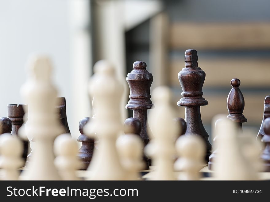 Selective Focus Photo of Chess Set
